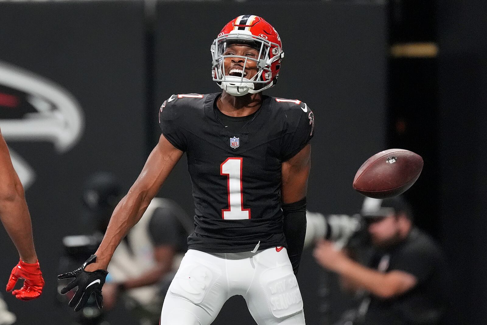 Atlanta Falcons wide receiver Darnell Mooney (1) reacts after his score against the Tampa Bay Buccaneers during the first half of an NFL football game Thursday, Oct. 3, 2024, in Atlanta. (AP Photo/John Bazemore)