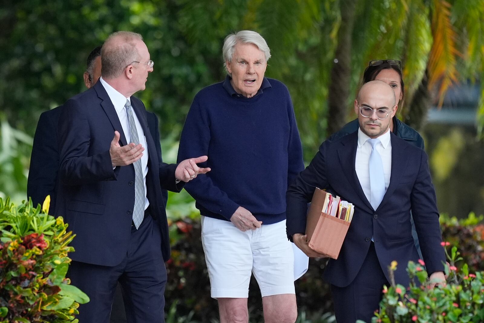 Michael Jeffries, center, former CEO of Abercrombie & Fitch, leaves with his attorney Brian Bieber, left, following a hearing at the Paul G. Rogers Federal Building and U.S. Courthouse, in West Palm Beach, Fla., Tuesday, Oct. 22, 2024. (AP Photo/Rebecca Blackwell)