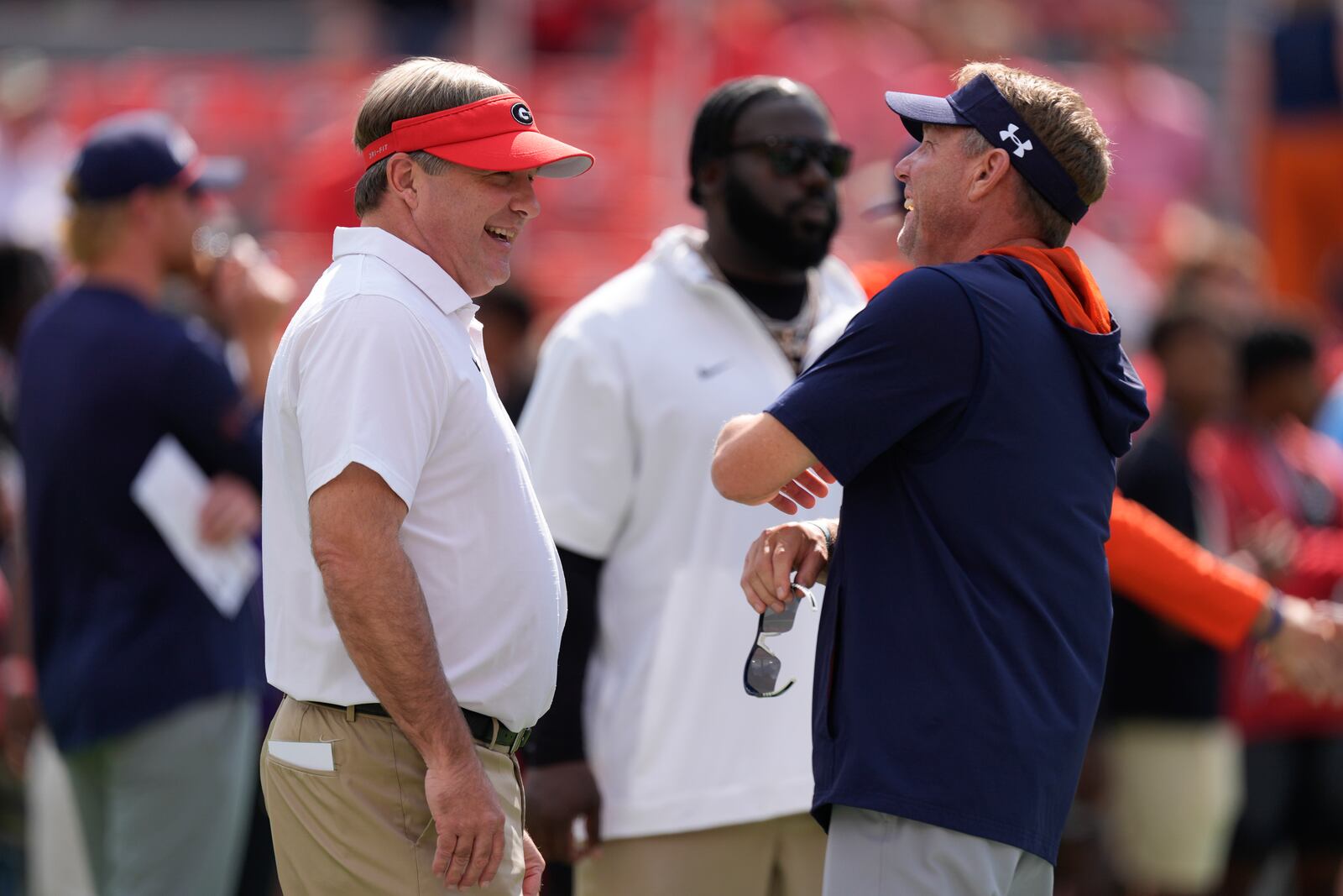 Georgia head coach Kirby Smart, left, and uburn head coach Hugh Freeze chat before an NCAA college football game Saturday, Oct. 5, 2024, in Athens, Ga. (AP Photo/John Bazemore)