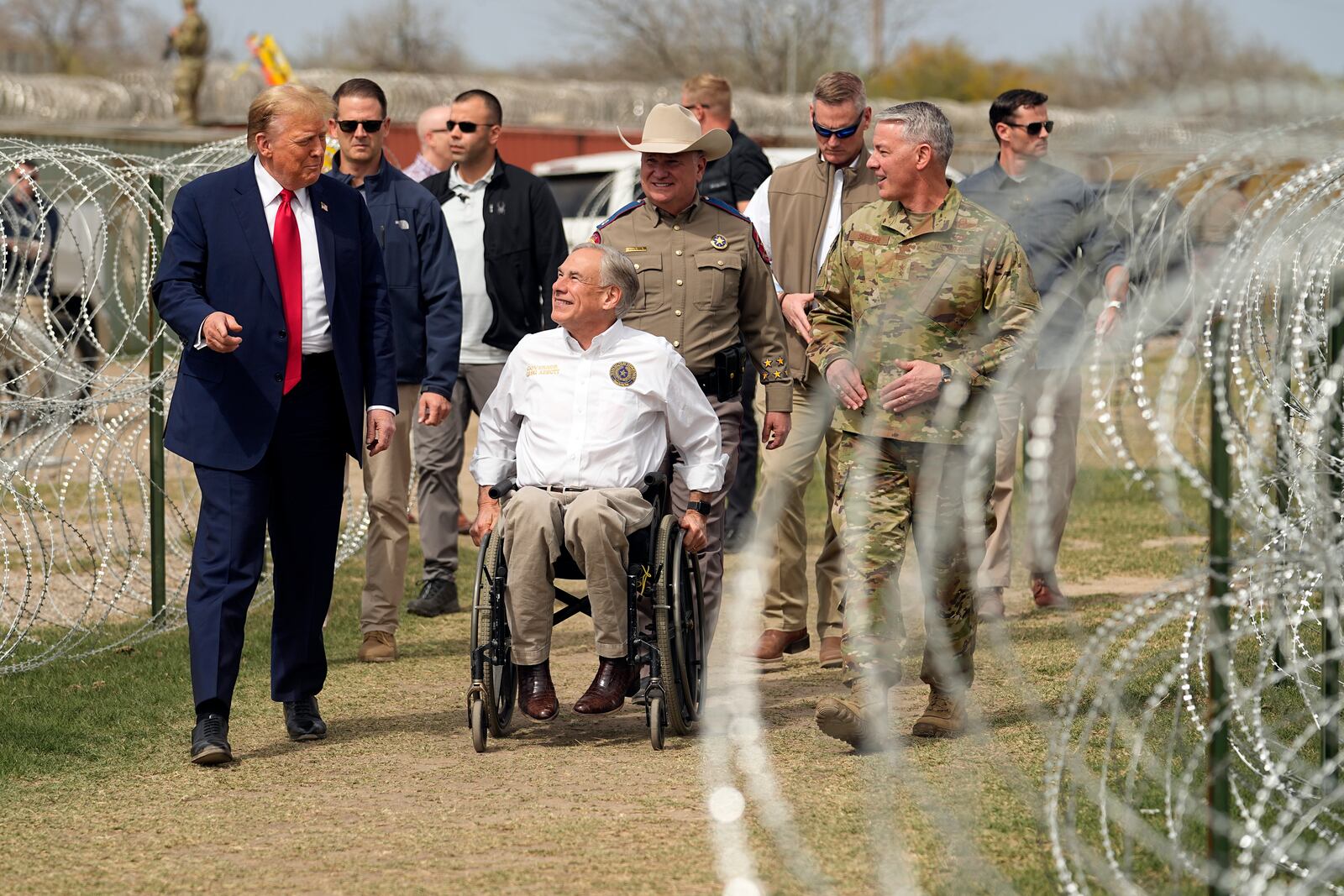 FILE - Republican presidential candidate former President Donald Trump talks with Texas Gov. Greg Abbott during a visit to the U.S.-Mexico border, on Feb. 29, 2024, in Eagle Pass, Texas. (AP Photo/Eric Gay)