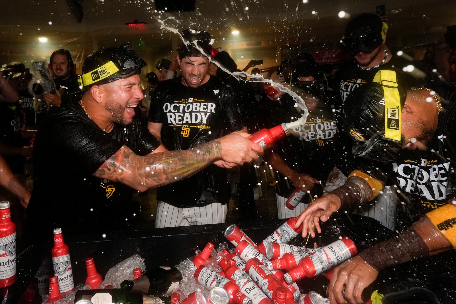 San Diego Padres players celebrate in the dugout after defeating the Atlanta Braves in Game 2 of an NL Wild Card Series baseball game Wednesday, Oct. 2, 2024, in San Diego. (AP Photo/Gregory Bull)