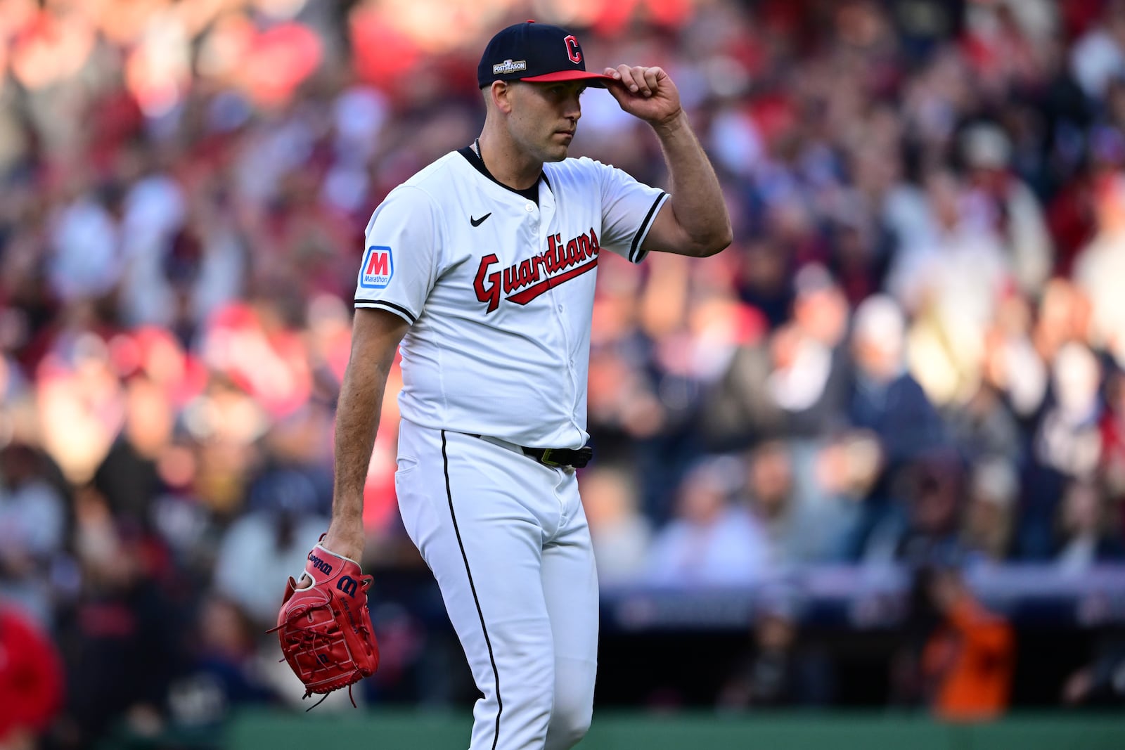 Cleveland Guardians starting pitcher Matthew Boyd tips his cap to the crowd as he walks off the field after being taken out of the game in the fifth inning during Game 2 of baseball's AL Division Series against the Detroit Tigers, Monday, Oct. 7, 2024, in Cleveland. (AP Photo/David Dermer)