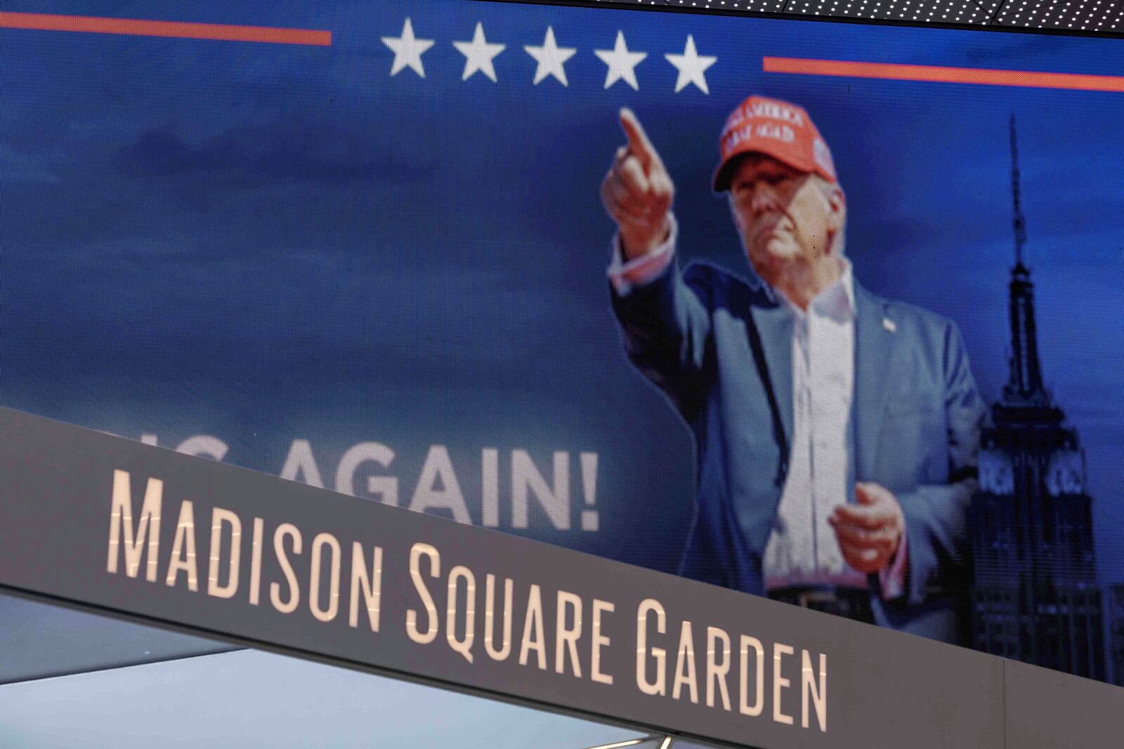 Video boards display information about the campaign rally for Republican presidential nominee former President Donald Trump outside Madison Square Garden, Sunday, Oct. 27, 2024, in New York. (AP Photo/Yuki Iwamura)