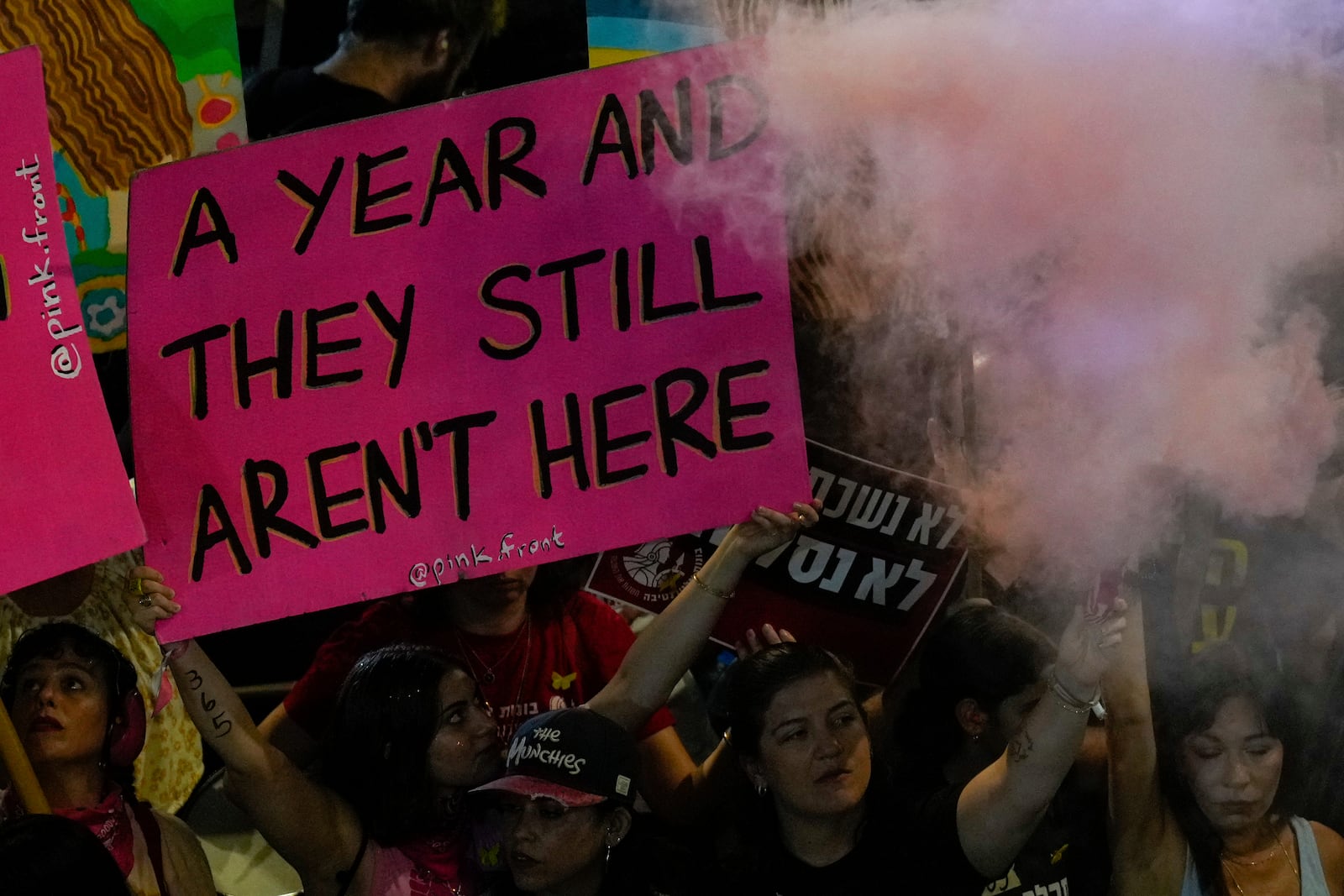 People protest and call for the release of hostages held in the Gaza Strip by the Hamas militant group, in Tel Aviv, Israel, Saturday, Oct. 5, 2024. (AP Photo/Ariel Schalit)