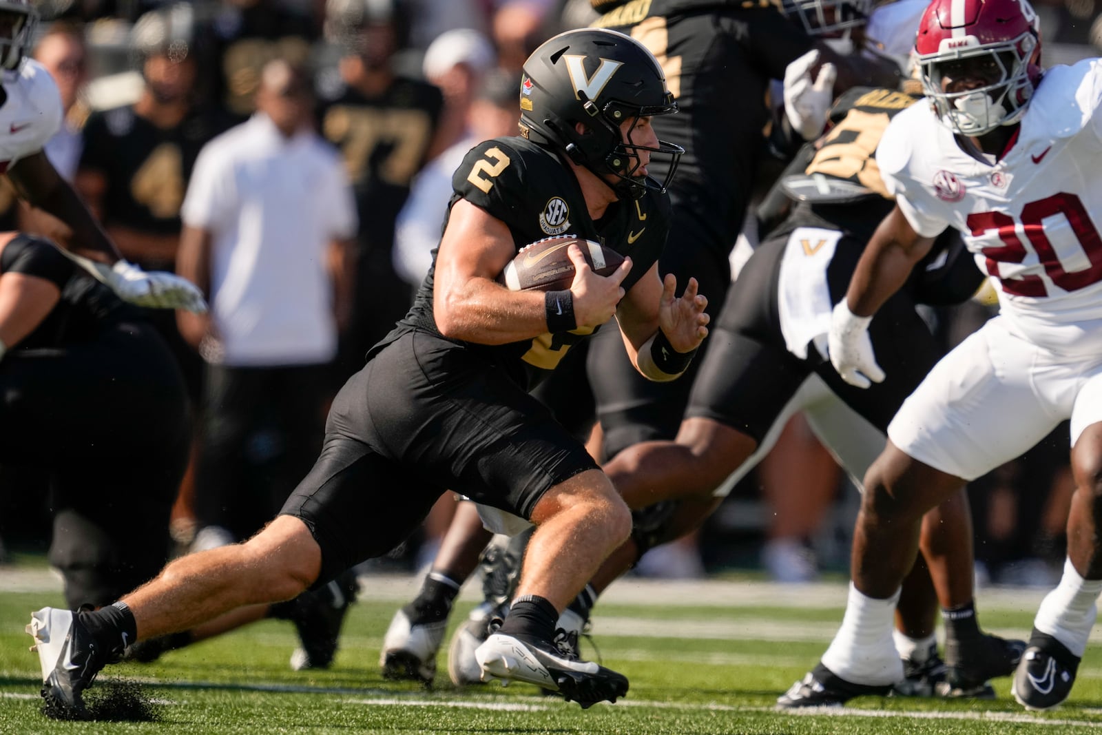 Vanderbilt quarterback Diego Pavia (2) runs the ball during the first half of an NCAA college football game against Alabama, Saturday, Oct. 5, 2024, in Nashville, Tenn. (AP Photo/George Walker IV)