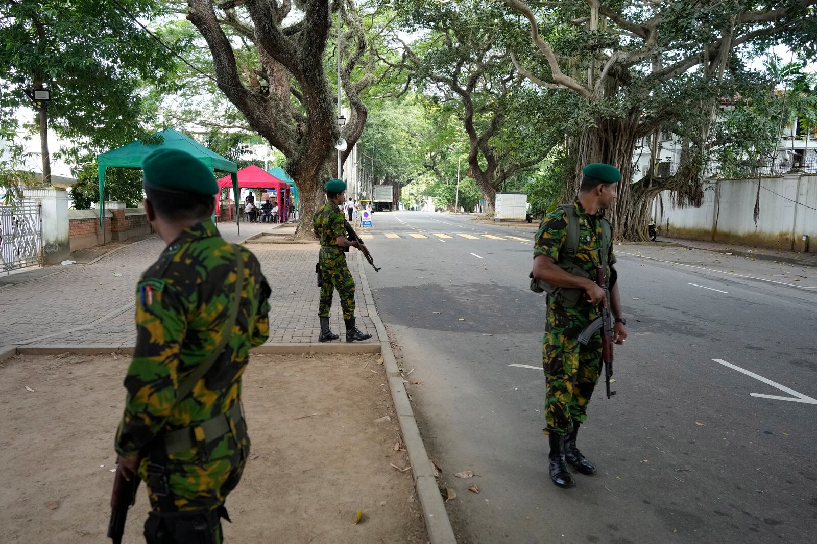 Police commandos stand guard outside a ballot counting center in Colombo, Sri Lanka, Saturday, Sept. 21, 2024. (AP Photo/Eranga Jayawardane)