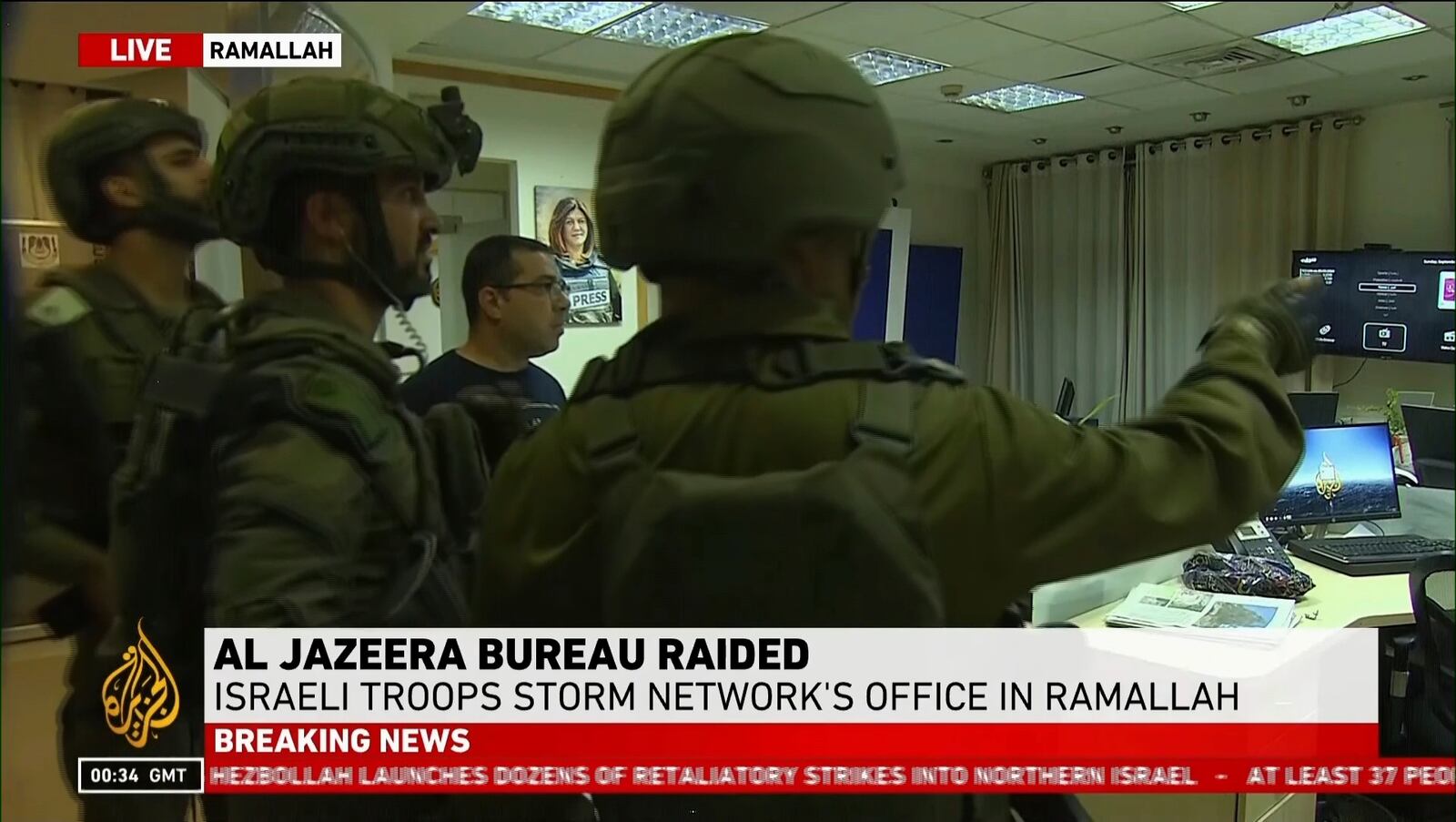 This image made from video provided by Al Jazeera English shows Israeli troops raiding their bureau in Ramallah, West Bank, Sunday, Sept. 22, 2024. (Al Jazeera via AP)