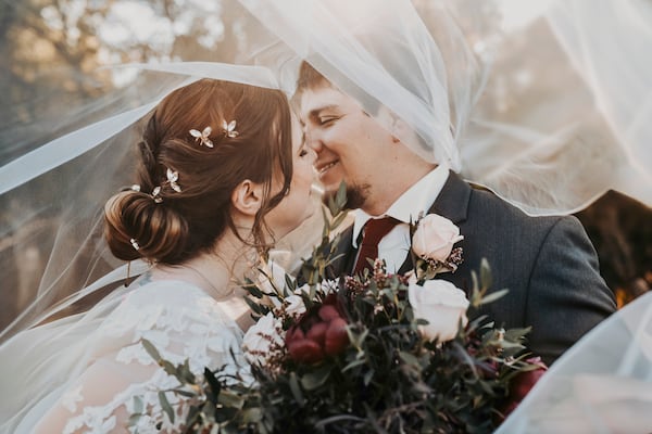 Anna and Garrick Hanney embrace on their wedding day in Krum, Texas on Oct. 19, 2024. (April Pinto Photography via AP)