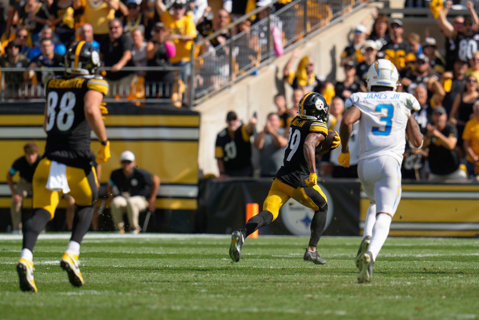 Pittsburgh Steelers wide receiver Calvin Austin III (19) runs with the ball after a catch for a touchdown during the second half of an NFL football game against the Los Angeles Chargers, Sunday, Sept. 22, 2024, in Pittsburgh. (AP Photo/Gene J. Puskar)