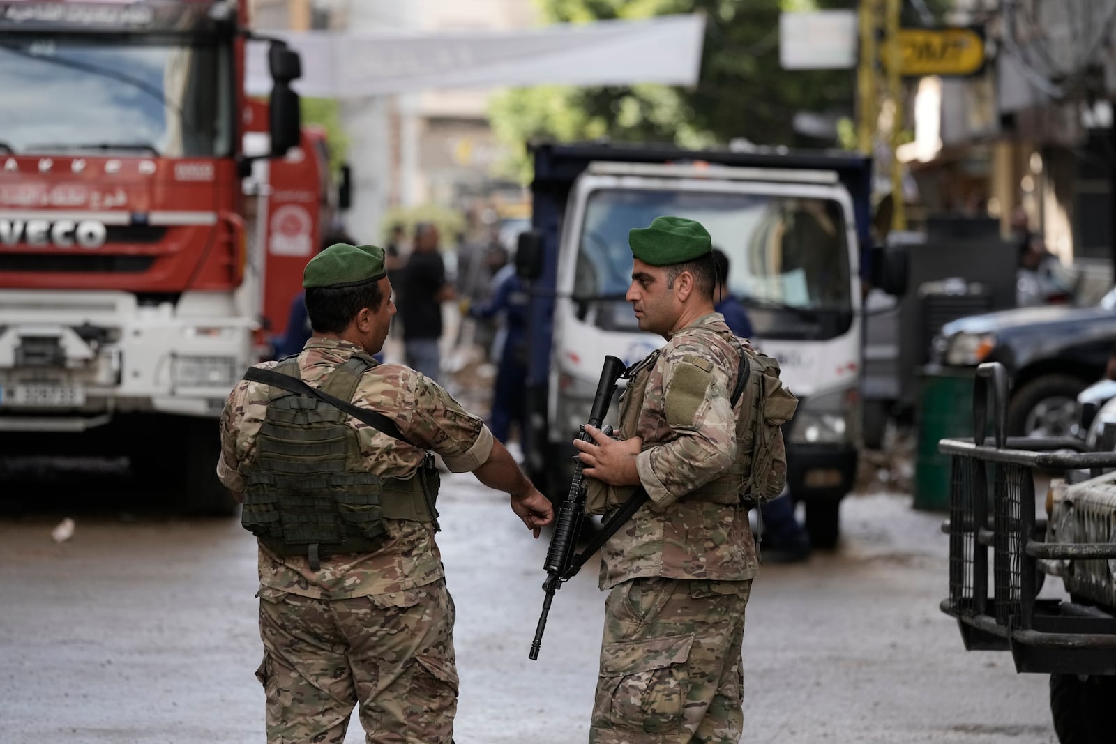 Lebanese soldiers stand guard near the site of Friday's Israeli strike in Beirut's southern suburb, Sunday, Sept. 22, 2024. (AP Photo/Bilal Hussein)