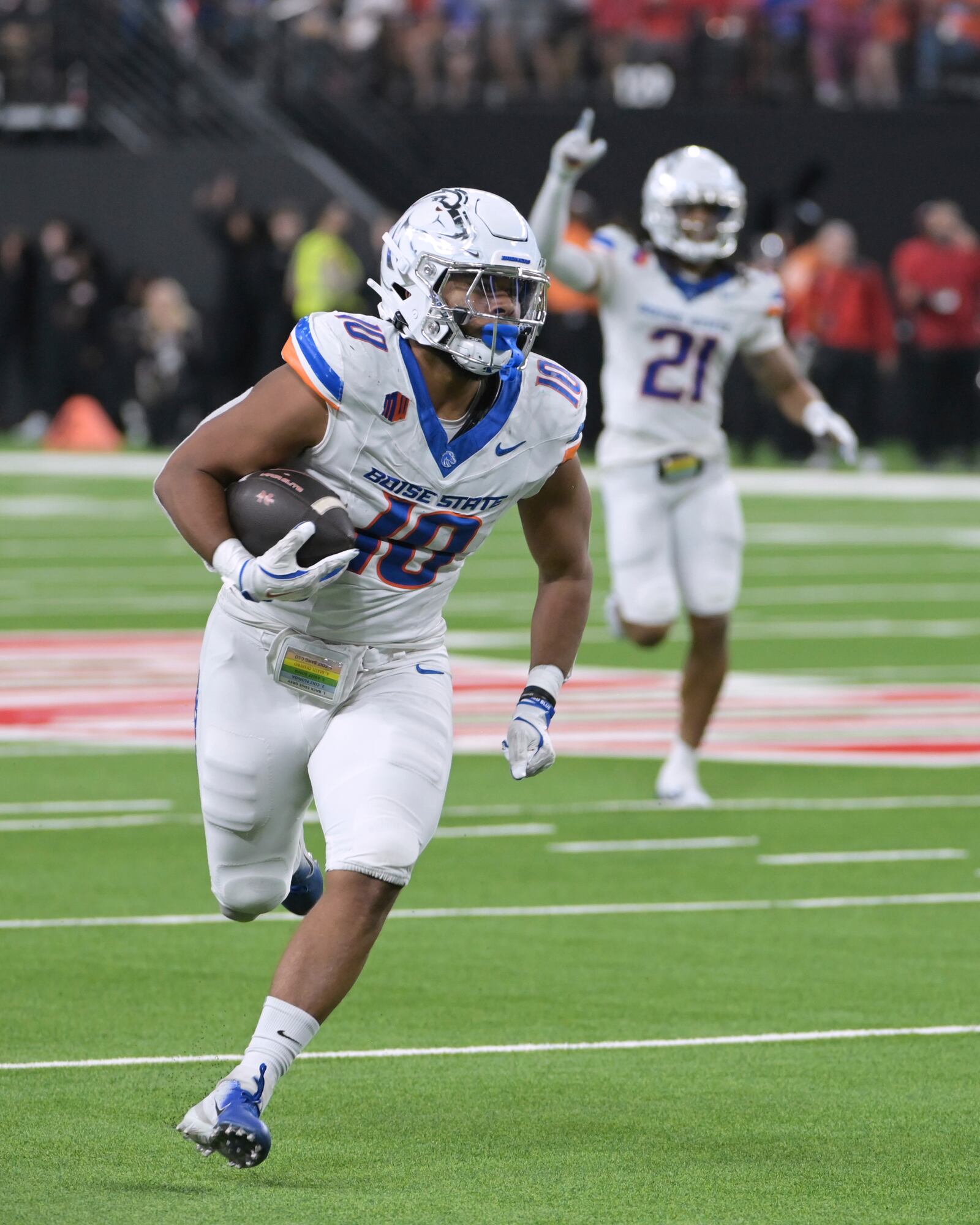 Boise State linebacker Andrew Simpson (10) runs back an interception against UNLV during the first half of an NCAA college football game Friday, Oct. 25, 2024, in Las Vegas. (AP Photo/Sam Morris)