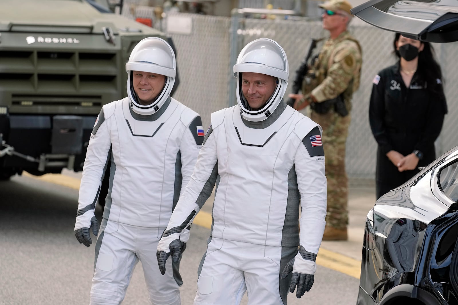 NASA astronaut Nick Hague, right, and Roscosmos cosmonaut Aleksandr Gorbunov leave the Operations and Checkout building for a trip to the launch pad 40 Saturday, Sept. 28, 2024, at the Kennedy Space Center in Cape Canaveral, Fla. (AP Photo/Chris O'Meara)