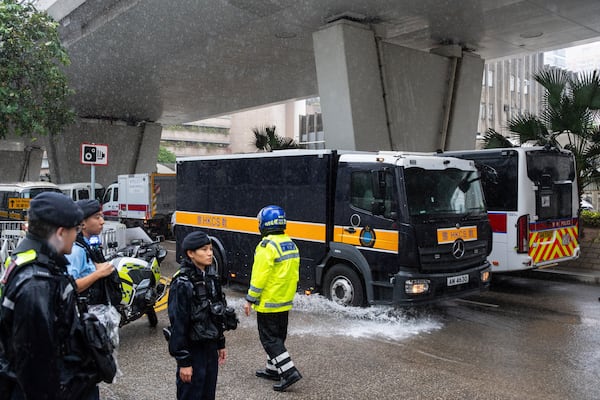 A Correctional Services Department vehicle arrives at the West Kowloon Magistrates' Courts in Hong Kong, Wednesday, Nov. 20, 2024, ahead of Hong Kong activist publisher Jimmy Lai's national security trial. (AP Photo/Chan Long Hei)