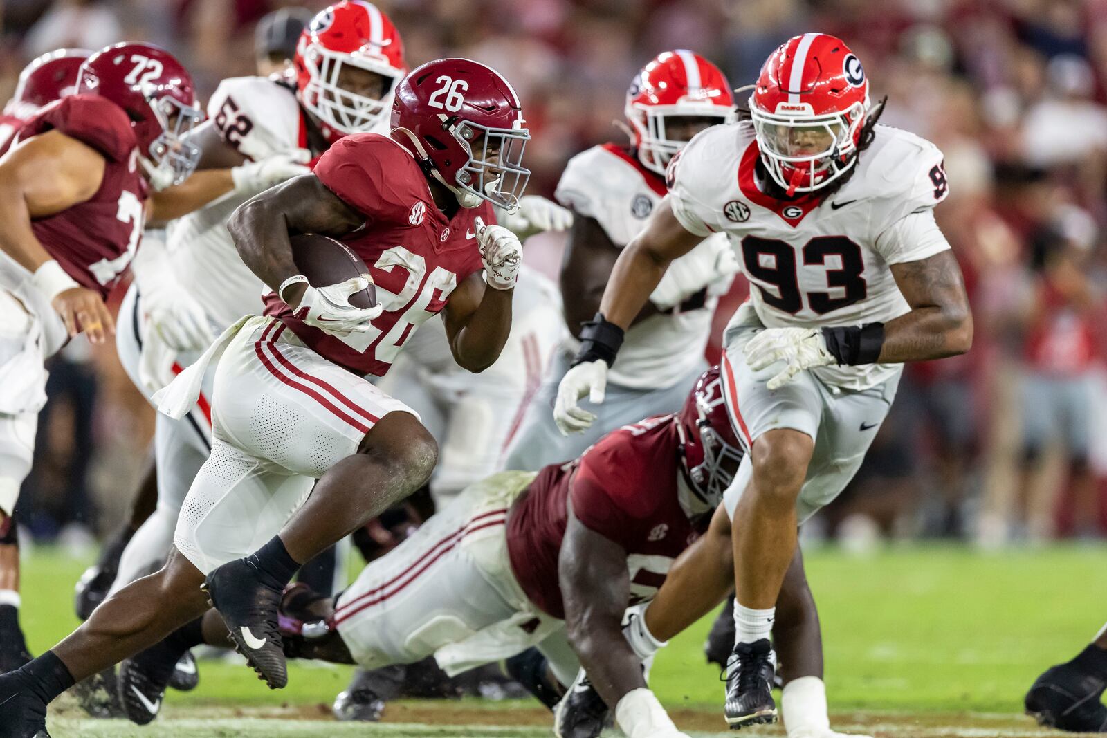 Alabama wide receiver Ryan Williams (2) runs the ball as Georgia defensive lineman Tyrion Ingram-Dawkins (93) pursues during the first half of an NCAA college football game, Saturday, Sept. 28, 2024, in Tuscaloosa, Ala. (AP Photo/Vasha Hunt)