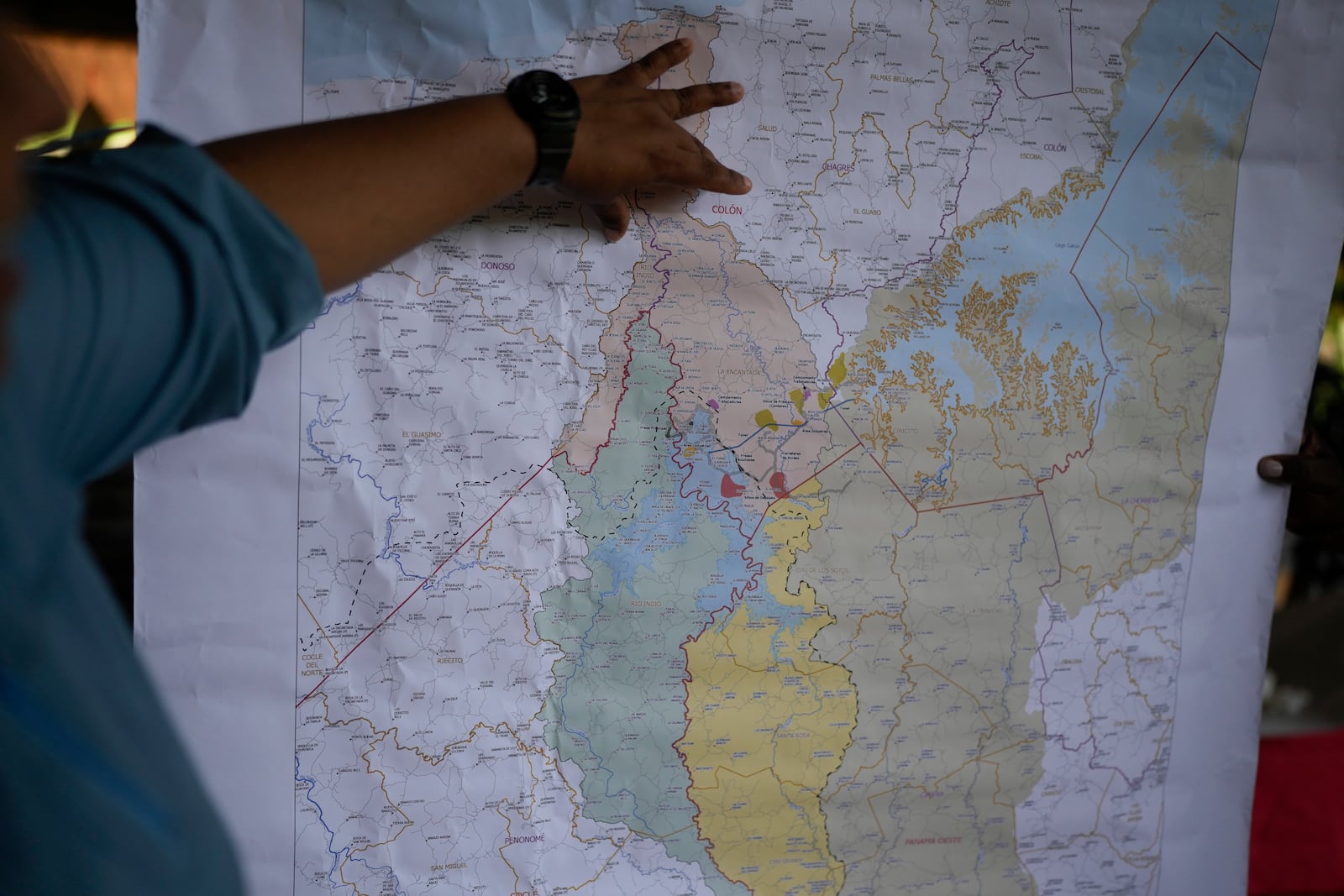 Panama Canal representatives explain to locals how a proposed dam project in the Indio River that aims to secure the canal's uninterrupted operation would affect the future of El Jobo, Panama, Saturday, Aug. 31, 2024. (AP Photo/Matias Delacroix)