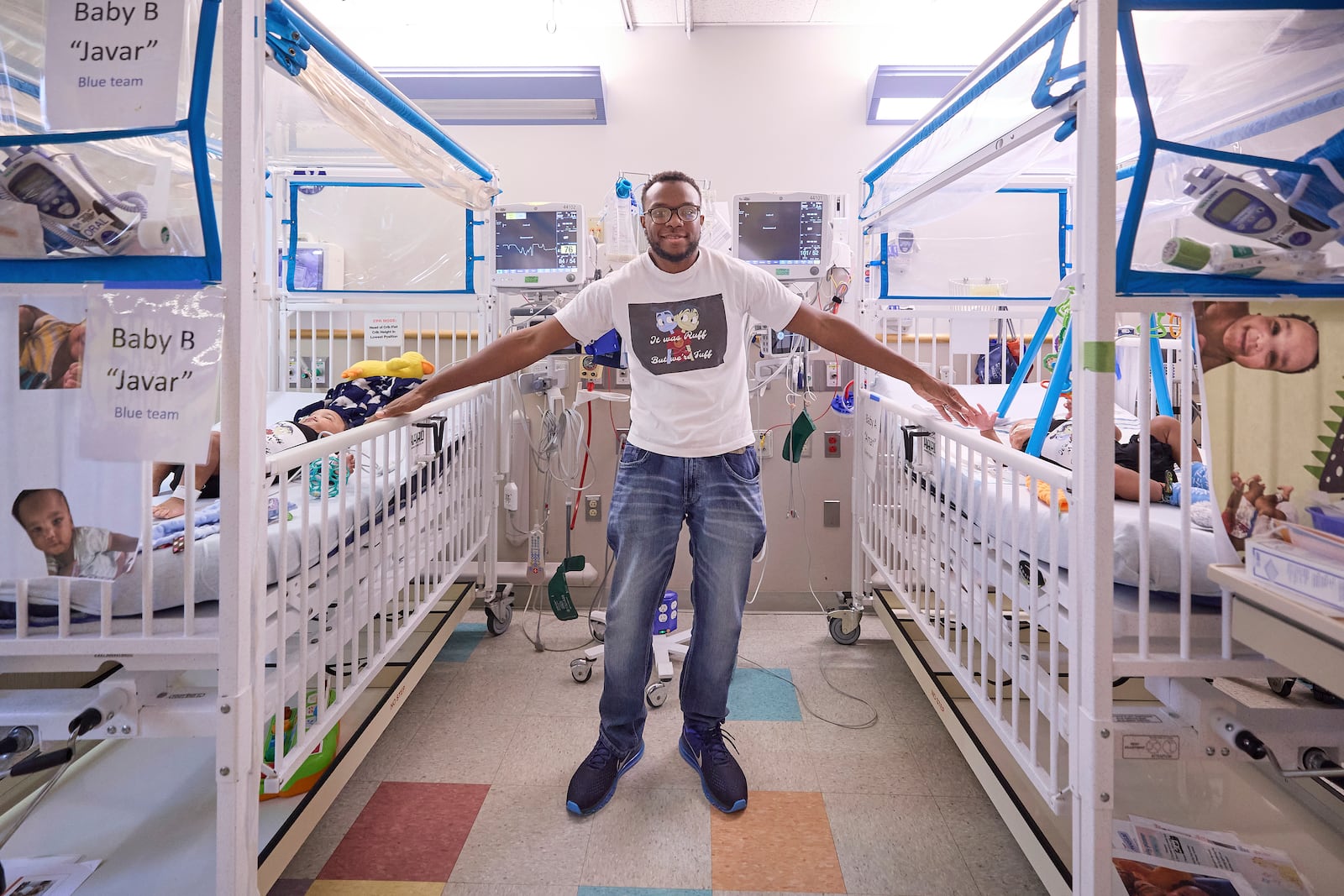 This undated photo provided by the Children’s Hospital of Philadelphia in October 2024 shows Tim Ruffin with his previously conjoined twins, after eparation surgery at the Children’s Hospital of Philadelphia. (Ed Cunicelli/Children’s Hospital of Philadelphia via AP)