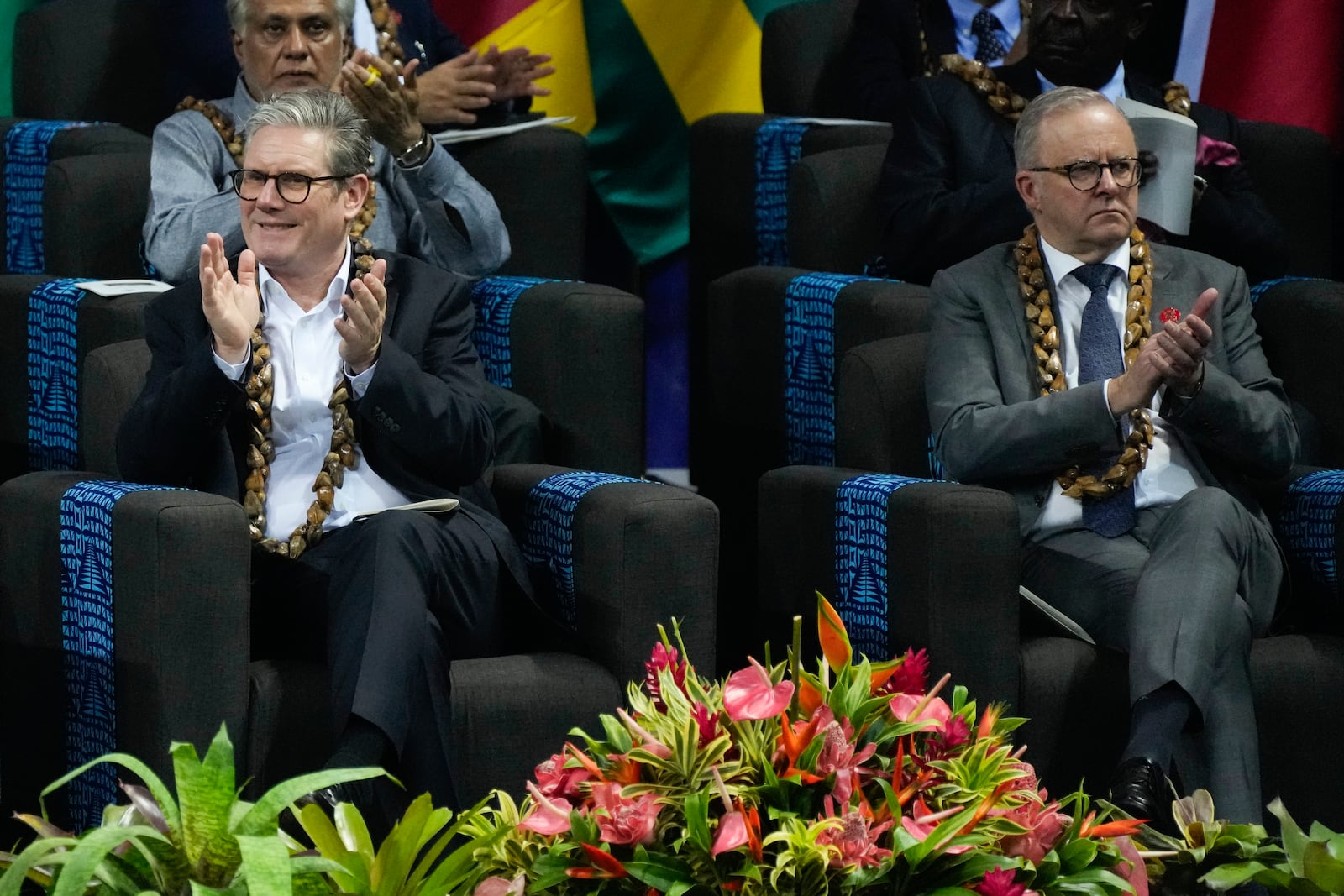 British Prime Minister Keir Starmer, left, and Australian Prime Minister Anthony Albanese react during the opening ceremony for the Commonwealth Heads of Government meeting in Apia, Samoa, Friday, Oct. 25, 2024. (AP Photo/Rick Rycroft/Pool)