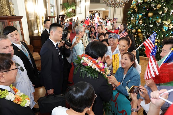 Taiwan President Lai Ching-te, center, greets people at the Kahala Hotel and Resort Saturday, Nov. 30, 2024 in Honolulu. (AP Photo/Marco Garcia)