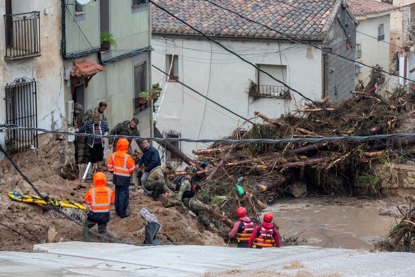 Members of the Spanish army and emergency services rescue people trapped in their homes after floods in Letur, Albacete, Tuesday, Oct. 29, 2024. (Víctor Fernández/Europa Press via AP)