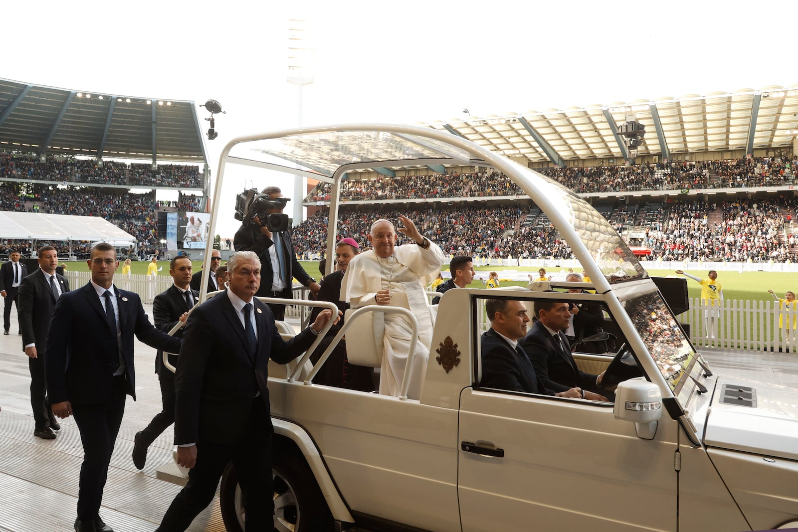 Pope Francis waves as he arrives to lead the holy mass , at the King Baudouin stadium in Brussels, Belgium, Sunday, Sept. 29, 2024. (AP Photo/Omar Havana)