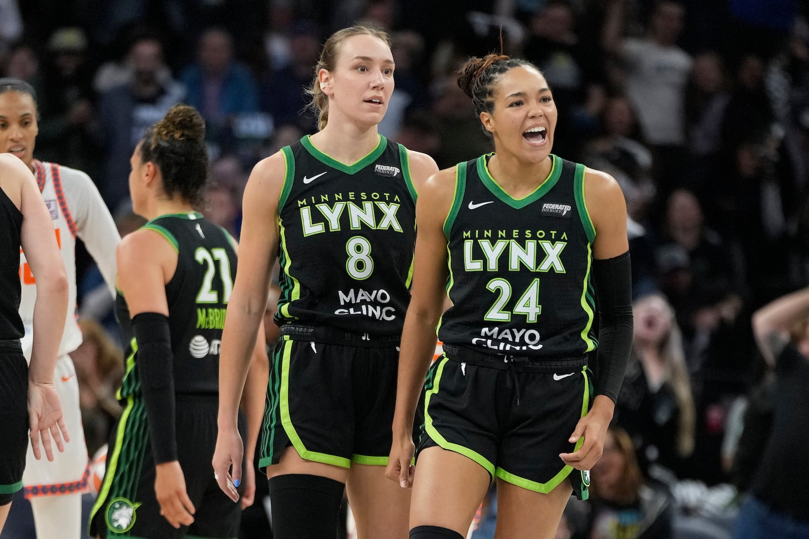 Minnesota Lynx forward Napheesa Collier (24) reacts after a Connecticut Sun timeout called during the first half of Game 5 of a WNBA basketball semifinals, Tuesday, Oct. 8, 2024, in Minneapolis. (AP Photo/Abbie Parr)