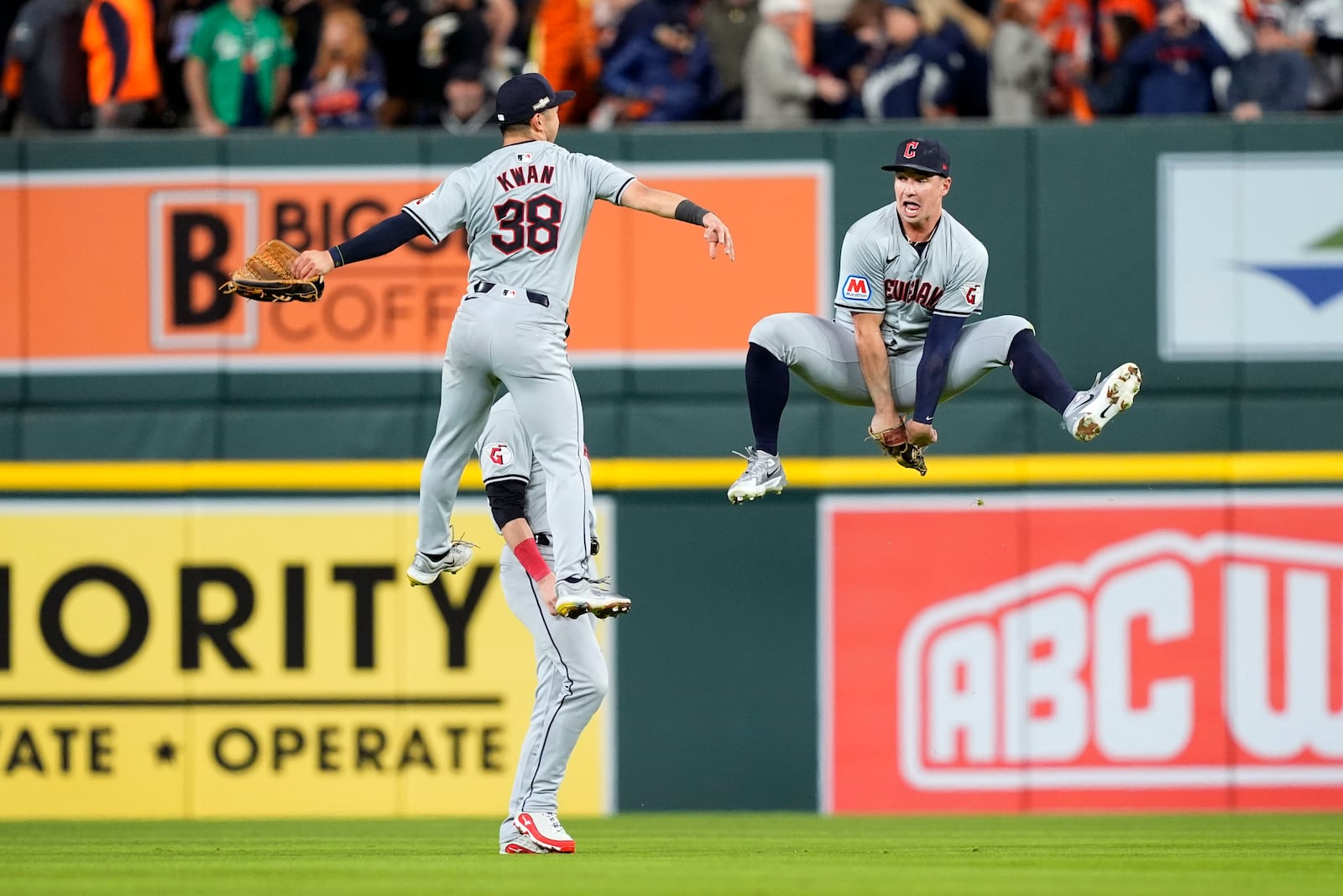 Cleveland Guardians' Steven Kwan (38) celebrates with teammate Will Brennan, right, at the end of Game 4 of a baseball American League Division Series against the Detroit Tigers, Thursday, Oct. 10, 2024, in Detroit. The Guardians won 5-4. (AP Photo/Carlos Osorio)