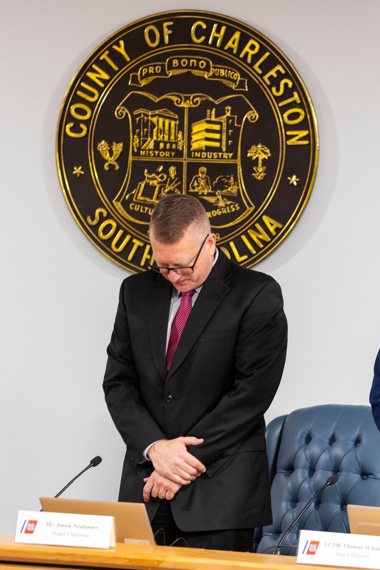 Jason Neubauer, board chairman, of the investigative board for the Titan marine board formal hearing pauses for a moment of silence inside the Charleston County Council Chambers Monday, Sept. 16, 2024, in North Charleston, S.C. (AP Photo/Mic Smith)