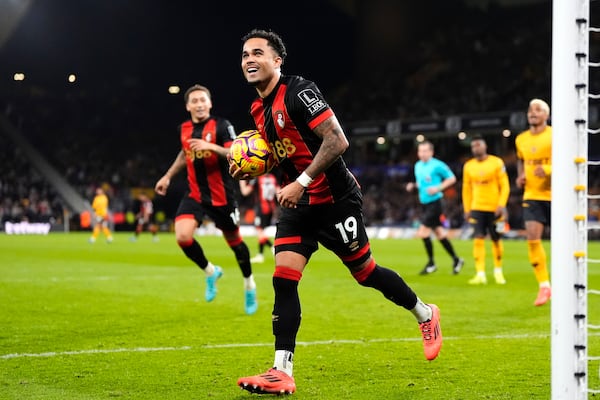 Bournemouth's Justin Kluivert celebrates scoring during the English Premier League soccer match at Molineux Stadium, Wolverhampton, England, Saturday Nov. 30, 2024. (Nick Potts/PA via AP)