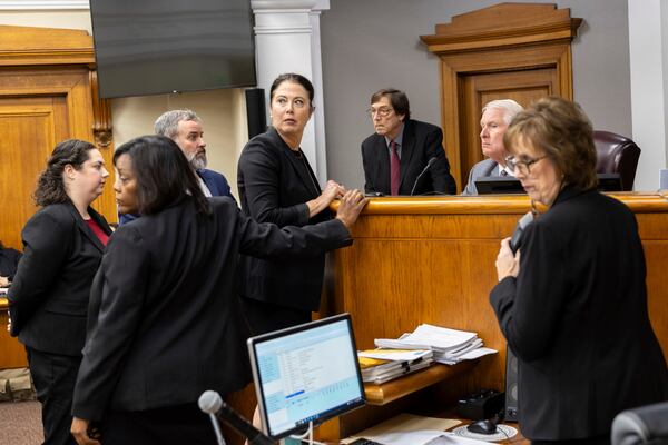 FILE - Prosecutors and defense attorneys meet with Judge H. Patrick Haggard during the murder trial of Venezuelan Jose Ibarra, at the Athens-Clarke County Superior Court, in Athens, Ga., Nov. 19, 2024. (Arvin Temkar/Atlanta Journal-Constitution via AP File)