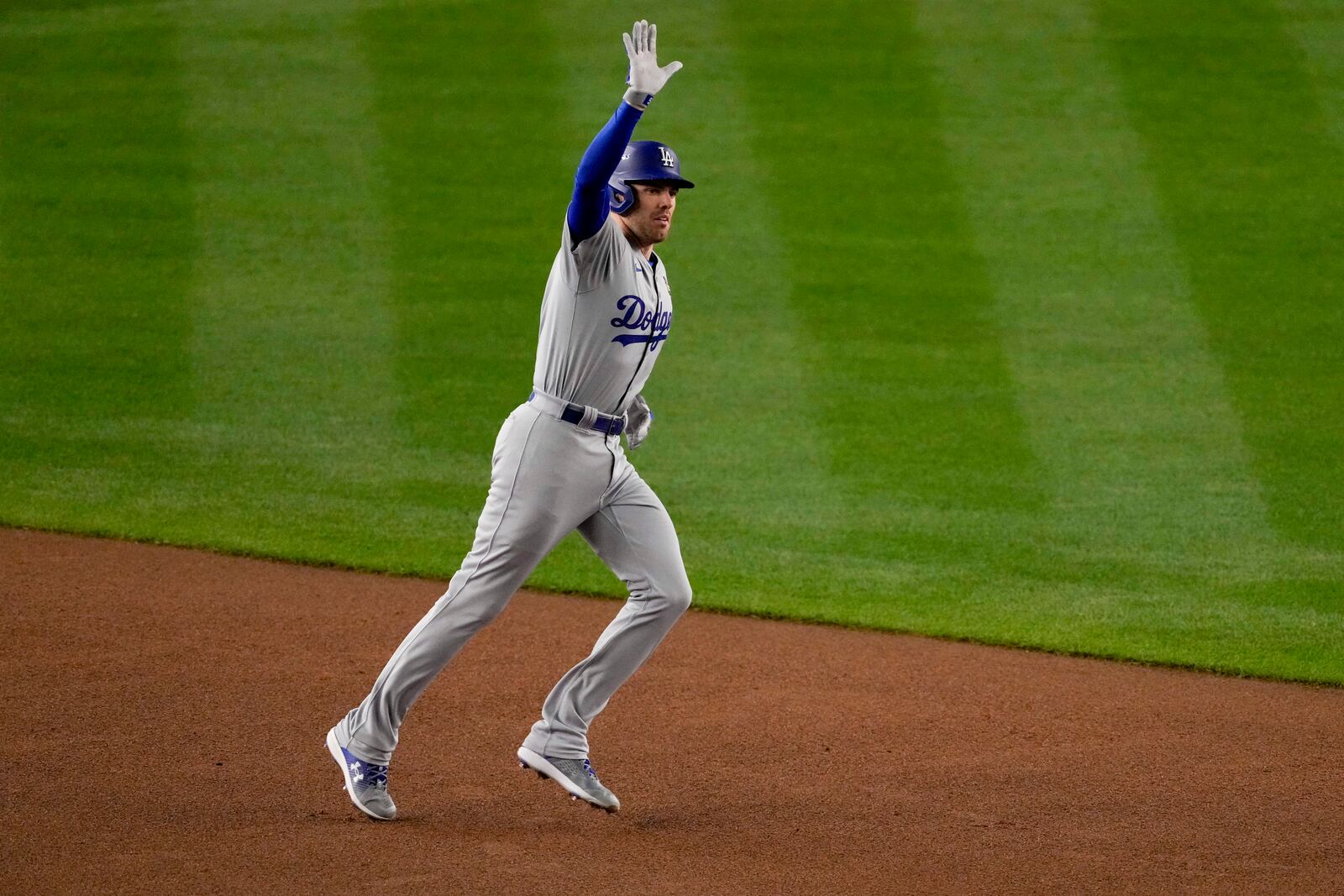 Los Angeles Dodgers' Freddie Freeman celebrates a two-run home run against the New York Yankees during the first inning in Game 3 of the baseball World Series, Monday, Oct. 28, 2024, in New York. (AP Photo/Frank Franklin II)