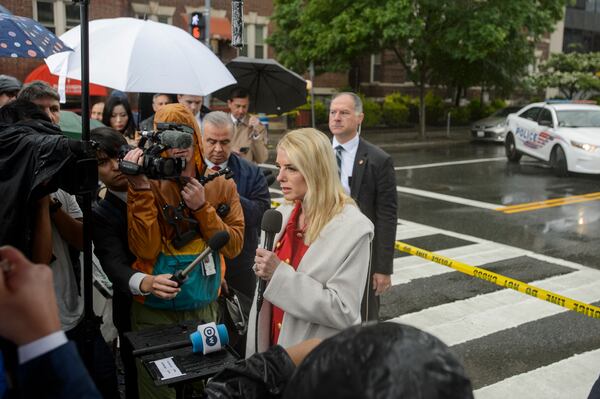 Attorney General Pam Bondi talks with reporters as law enforcement work the scene after two staff members of the Israeli Embassy in Washington were shot and killed outside the Capital Jewish Museum, Thursday, May 22, 2025, in Washington. (AP Photo/Rod Lamkey, Jr.)