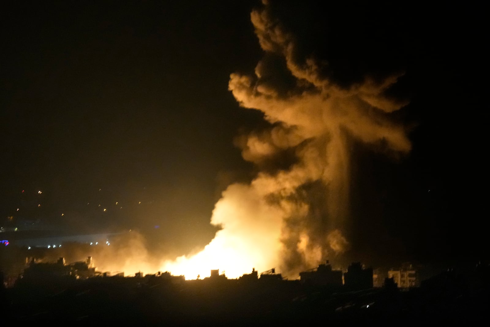 Flames and smoke rise from an Israeli airstrike in Dahiyeh, Beirut, Lebanon, early Sunday, Oct. 6, 2024. (AP Photo/Hussein Malla)