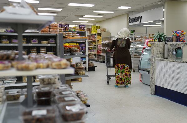 Locals shop at the Finest Supermarket halal grocery store in Fredericksburg, Va., on Monday, April 7, 2025. (AP Photo/Jessie Wardarski)