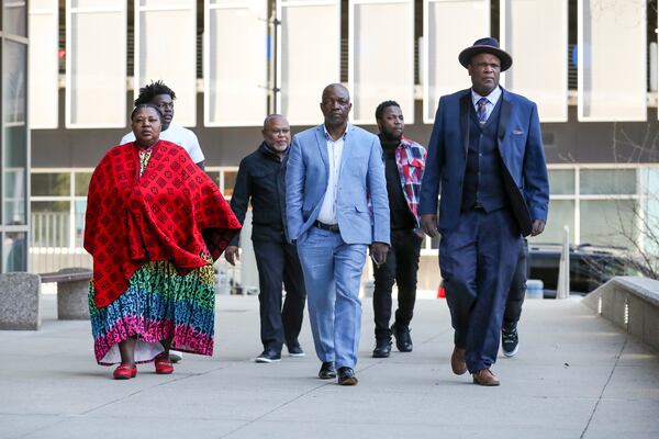The family of Patrick Lyoya and Kent County commissioner Robert Womack, right, arrive outside the Kent County Courthouse in Grand Rapids, Mich., Monday, April 28, 2025. (Chris duMond/Detroit News via AP)