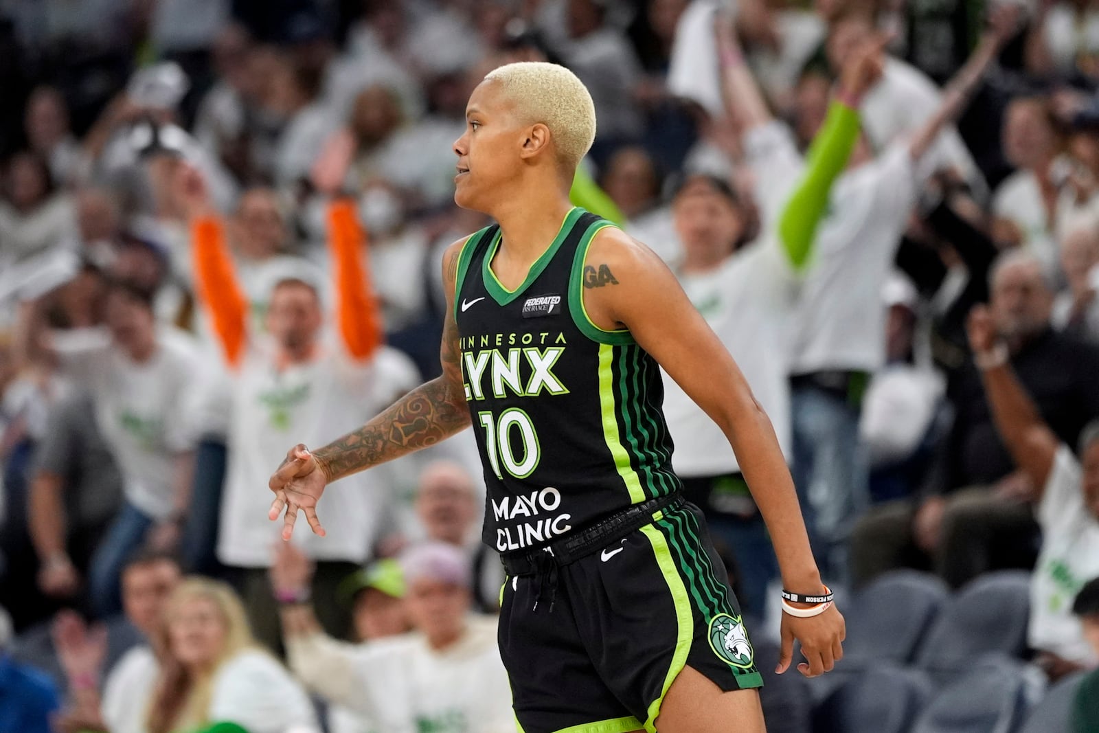 Minnesota Lynx guard Courtney Williams reacts after making a 3-point basket during the second half against the New York Liberty in Game 3 of a WNBA basketball final playoff series, Wednesday, Oct. 16, 2024, in Minneapolis. (AP Photo/Abbie Parr)