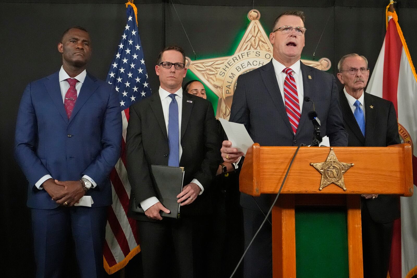 FILE - Ronald Rowe Jr., the acting director of the Secret Service, speaks during a news conference by law enforcement officials, Sept. 16, 2024, at the Palm Beach County Sheriff's Office in West Palm Beach, Fla. Listening in are, from left, U.S. Attorney Markenzy Lapointe, for the Southern District of Florida, Special Agent in Charge Jeffrey B. Veltri of the FBI Miami Field Office, and Palm Beach County Sheriff Ric Bradshaw. (AP Photo/Wilfredo Lee, File)