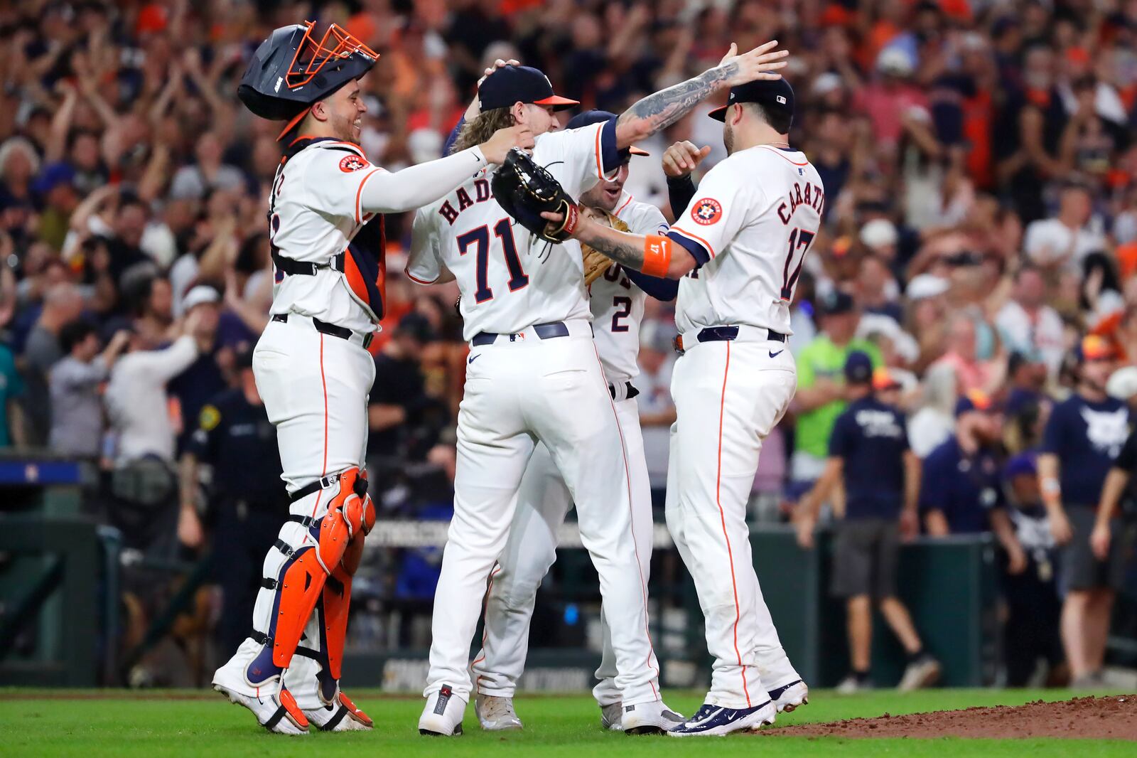 Houston Astros players, from left, Yainer Diaz, Josh Hader, Alex Bregman and Victor Caratini celebrate after the last out against the Seattle Mariners to clinch the AL West title at the end of a baseball game Tuesday, Sept. 24, 2024, in Houston. (AP Photo/Michael Wyke)