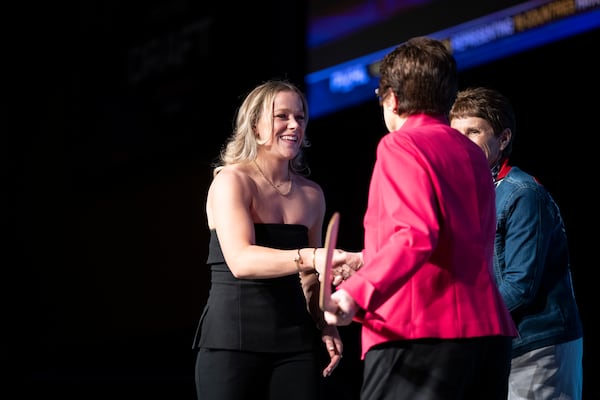 FILE - No. 1 overall draft pick Sarah Fillier, left, who was drafted by New York, shakes hands with tennis great Billie Jean King, front right, during the PWHL hockey draft in St. Paul, Minn., Monday June, 10, 2024. (Renée Jones Schneider/Star Tribune via AP, File)