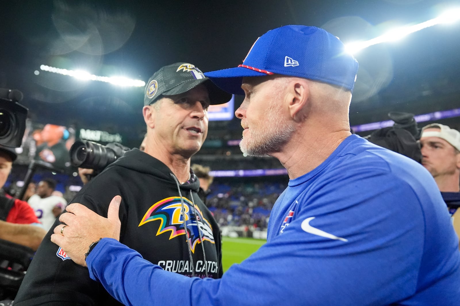 Baltimore Ravens head coach John Harbaugh, left, talks with Buffalo Bills head coach Sean McDermott following an NFL football game, Sunday, Sept. 29, 2024, in Baltimore. The Ravens won 35-10. (AP Photo/Stephanie Scarbrough)