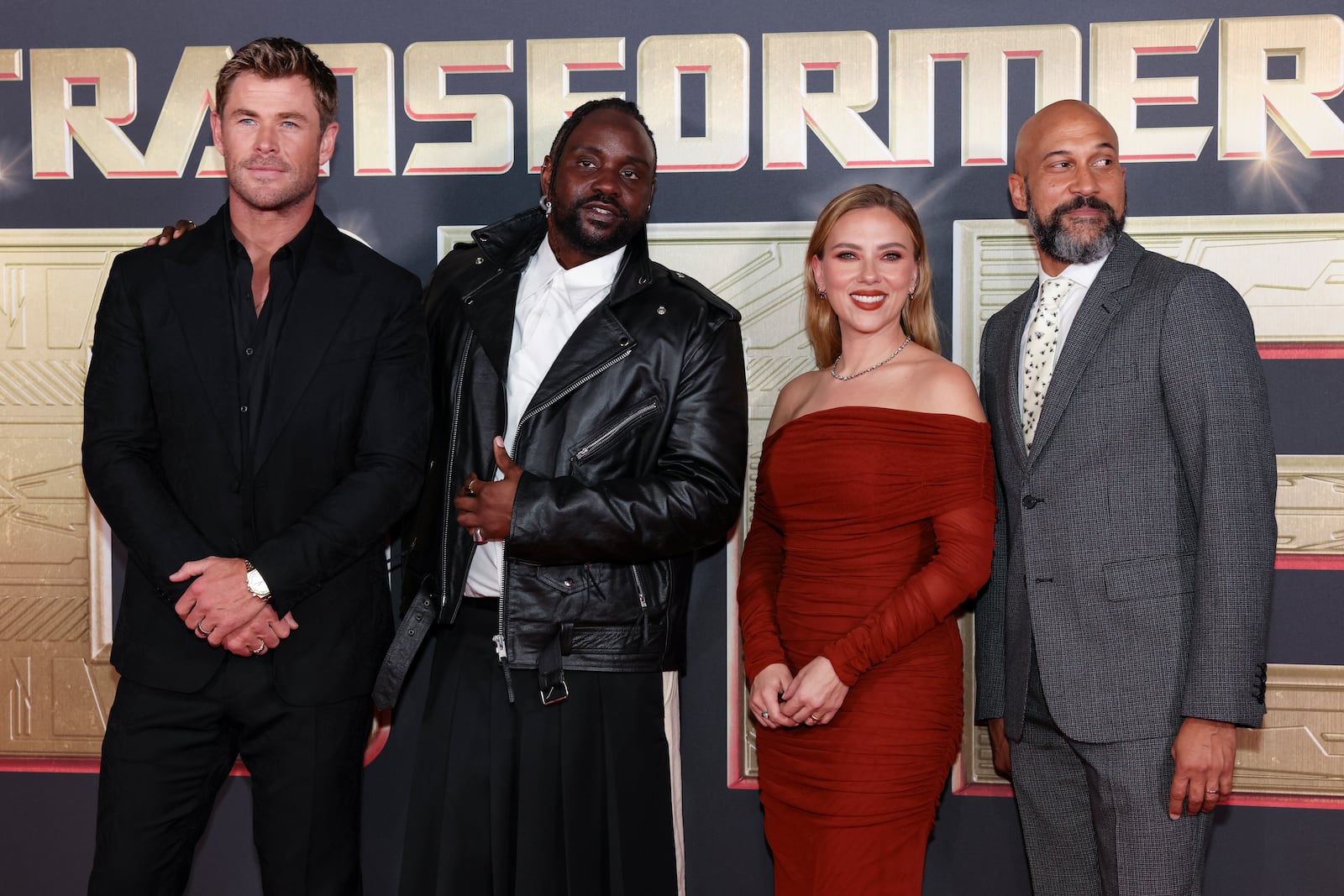 Chris Hemsworth, from left, Brian Tyree Henry, Scarlett Johansson and Keegan-Michael Key pose for photographers upon arrival at the premiere for the film 'Transformers One' on Thursday, Sept. 19, 2024 in London. (Photo by Vianney Le Caer/Invision/AP)