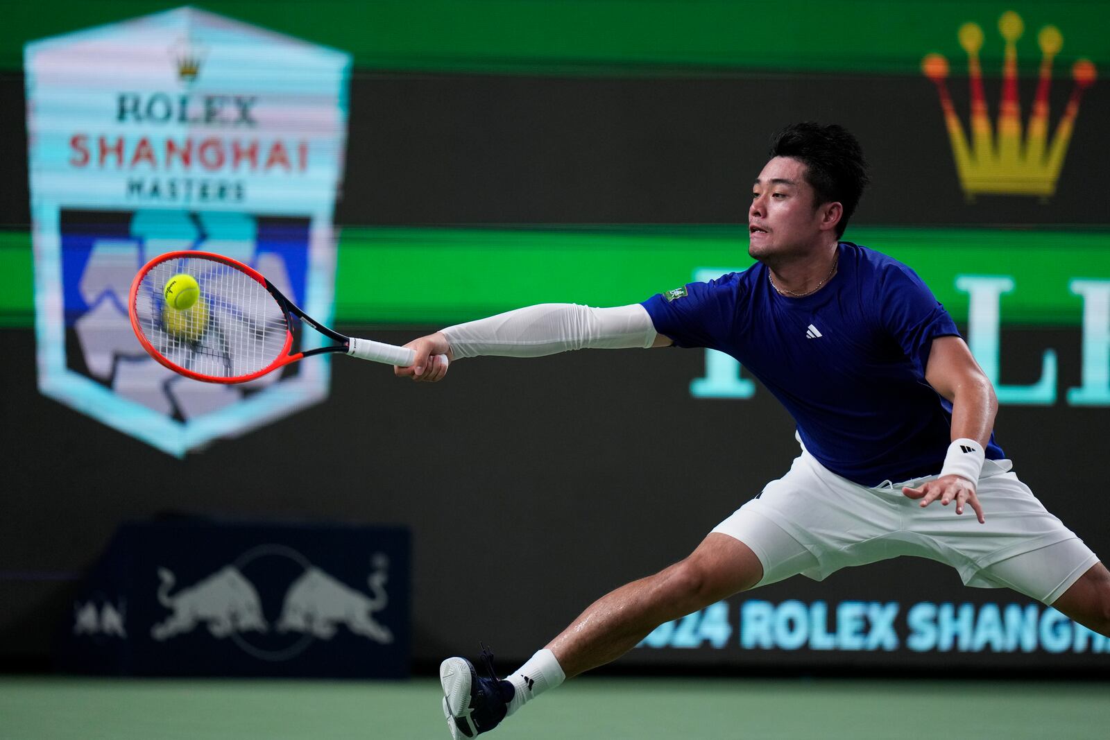 Wu Yibing of China returns a forehand shot to Carlos Alcaraz of Spain during the men's singles third round match of the Shanghai Masters tennis tournament at Qizhong Forest Sports City Tennis Center in Shanghai, China, Sunday, Oct. 6, 2024. (AP Photo/Andy Wong)