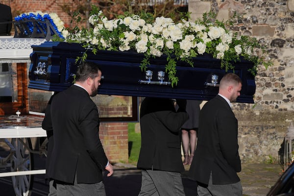 Pallbearers carry the coffin into the funeral service of One Direction singer Liam Payne at St Mary's Church in Amersham, England, Wednesday, Nov. 20, 2024. (Jonathan Brady/PA via AP)