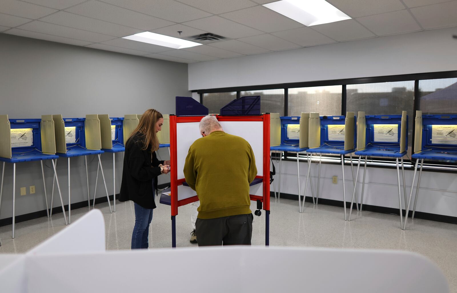 Minneapolis residents cast their votes at the City of Minneapolis early voting center, Friday, September 20, 2024, in Minneapolis, Minn. (AP Photo/Adam Bettcher)