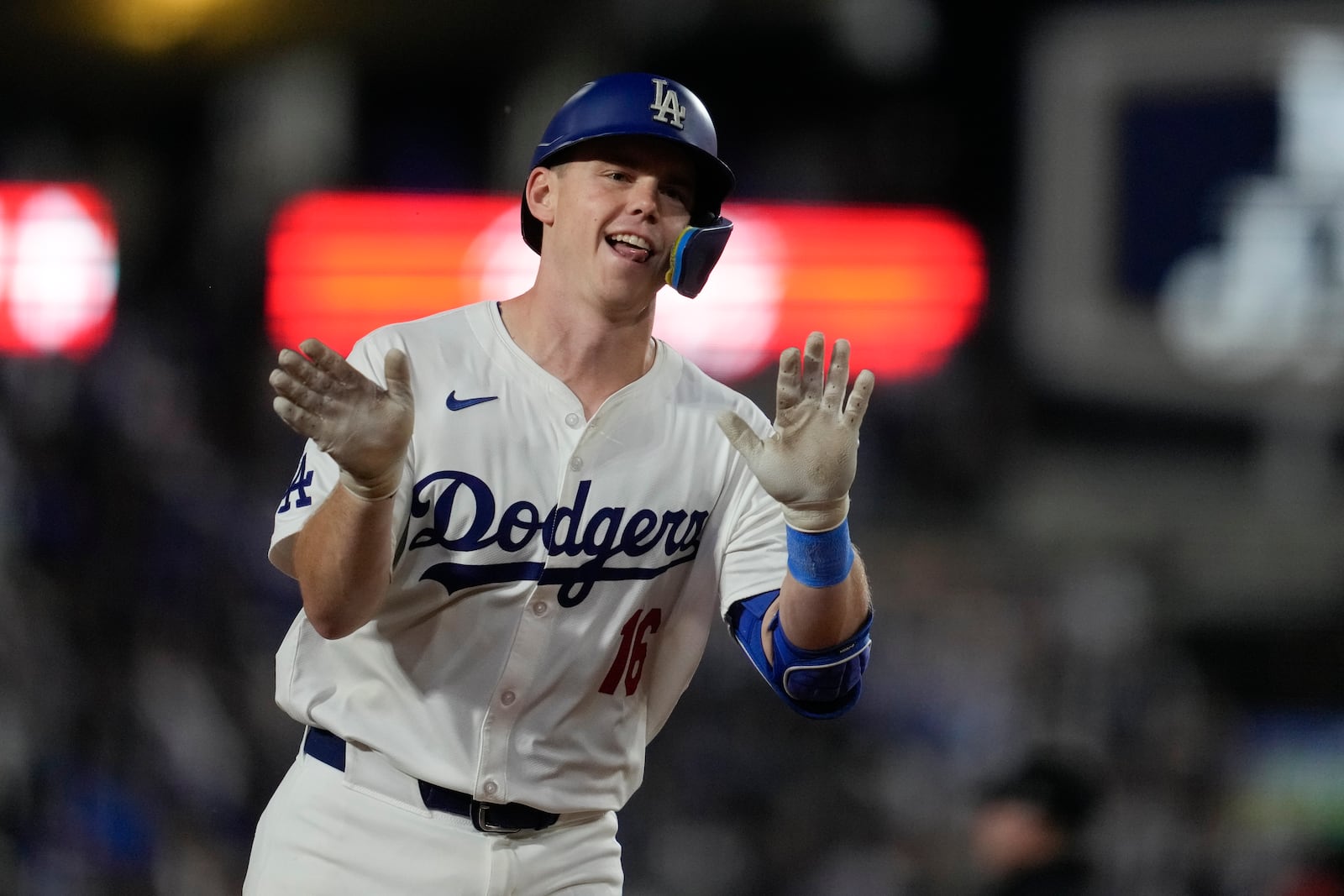 Los Angeles Dodgers' Will Smith celebrates after hitting a two-run home run during the seventh inning of a baseball game against the San Diego Padres, Thursday, Sept. 26, 2024, in Los Angeles. (AP Photo/Ashley Landis)