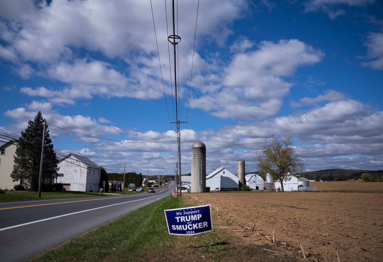 A Republican political advertisement is displayed in Ephrata, Pa., on Wednesday, Oct. 16, 2024. (AP Photo/Jessie Wardarski)