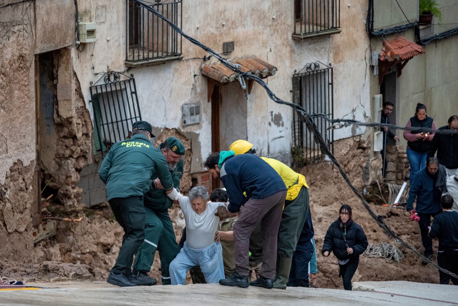 Members of emergency services and Guardia Civil rescue people trapped in their homes after floods in Letur, Albacete, Tuesday, Oct. 29, 2024. (Víctor Fernández/Europa Press via AP)