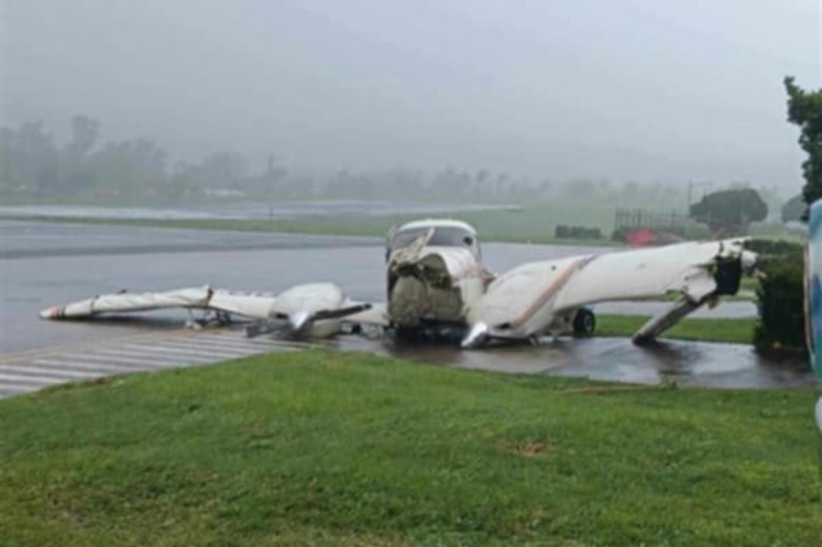 In this photo provided by the Civil Aviation Authority of the Philippines, a plane damaged by powerful Typhoon Krathon lies at the Basco airport as the typhoon hit Basco, Batanes province, northern Philippines Monday, Sept. 30, 2024. (Civil Aviation Authority of the Philippines via AP)