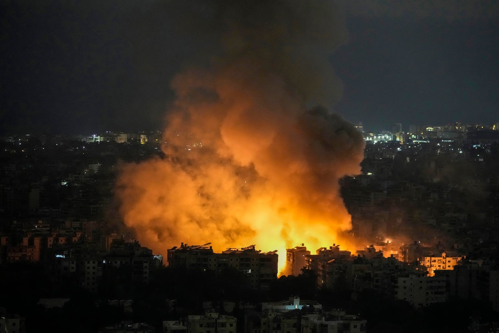 Flames and smoke rise from an Israeli airstrike in Dahiyeh, Beirut, Lebanon, Sunday, Oct. 6, 2024. (AP Photo/Bilal Hussein)