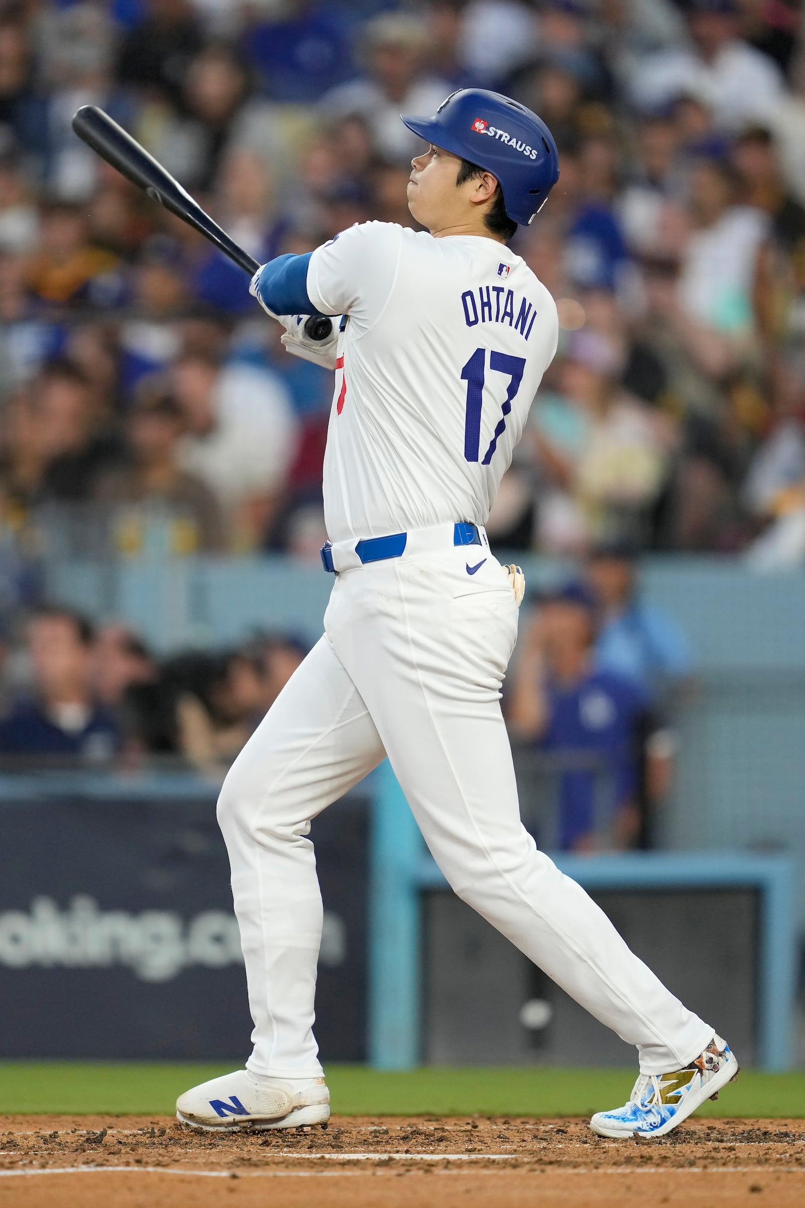 Los Angeles Dodgers' Shohei Ohtani watches his three-run home run during the second inning in Game 1 of baseball's NL Division Series against the San Diego Padres, Saturday, Oct. 5, 2024, in Los Angeles. (AP Photo/Ashley Landis)