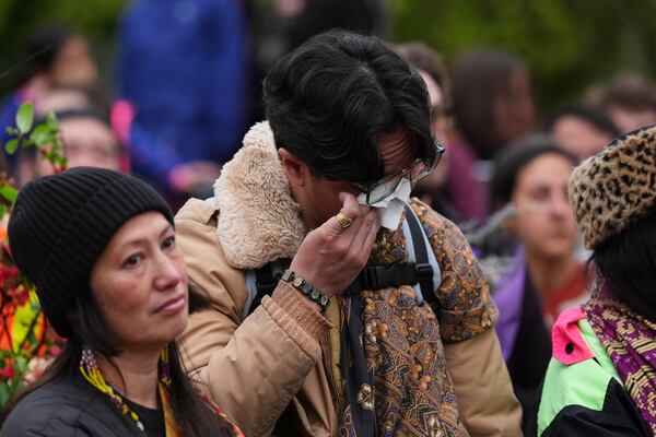 Ben Castro wipes tears from his eyes during a vigil at Sir Alexander Mackenzie Elementary School after a vehicle drove into a crowd during a Filipino heritage festival in Vancouver, British Columbia, Monday, April 28, 2025. (AP Photo/Lindsey Wasson)